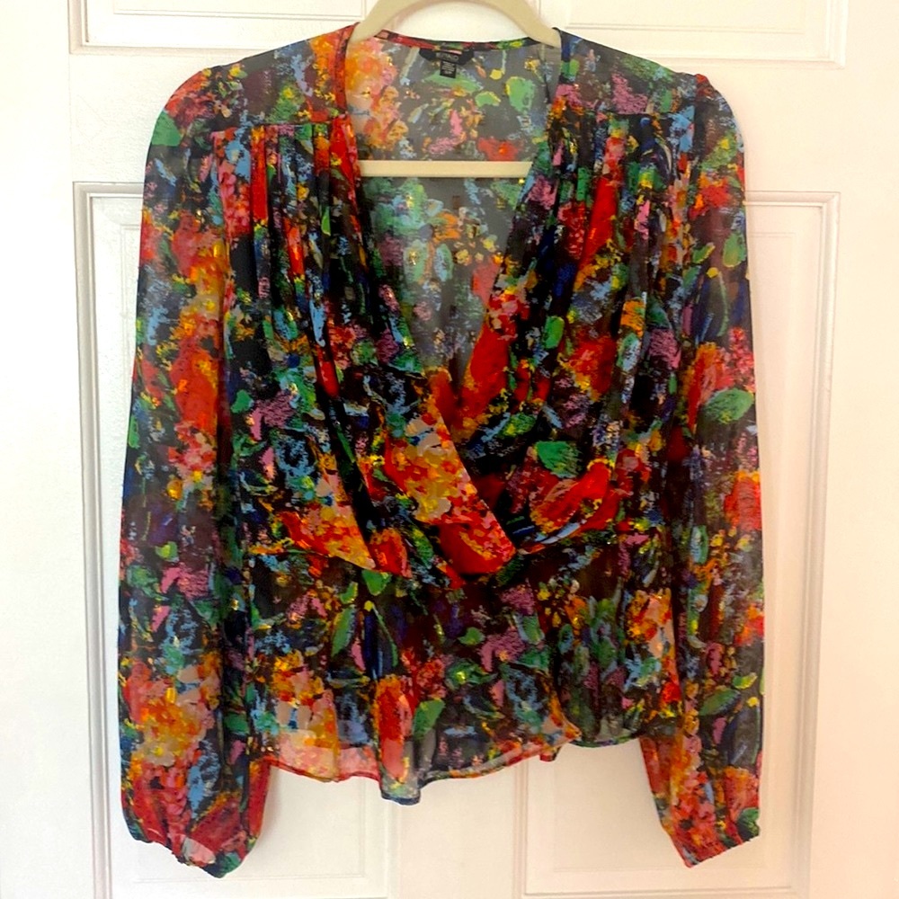 Shimmery multi color blouse pairs so well with jeans and heels